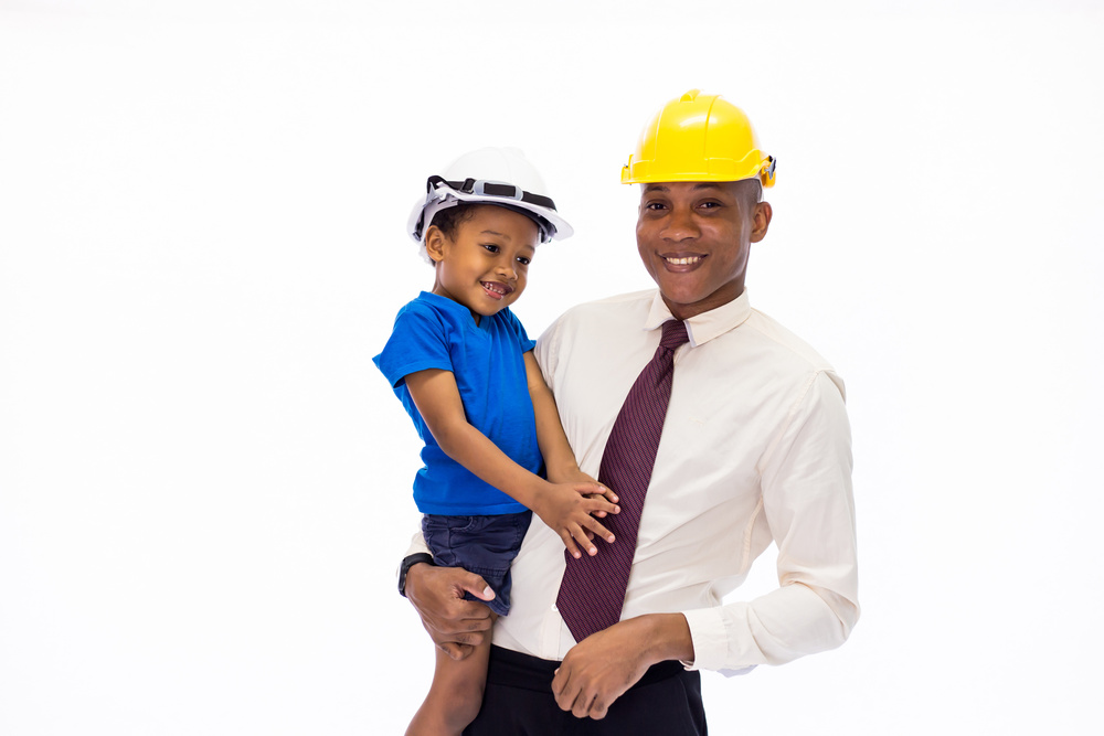 African American Happy Family of Father and Son Wearing an Engin